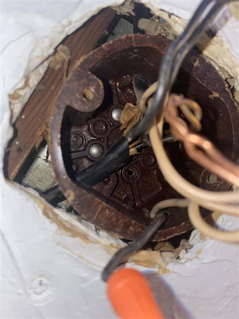 how to remove an old electrical box from the ceiling|removing an old ceiling fan.